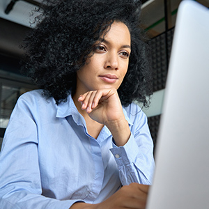 Young career woman works on a computer assessment